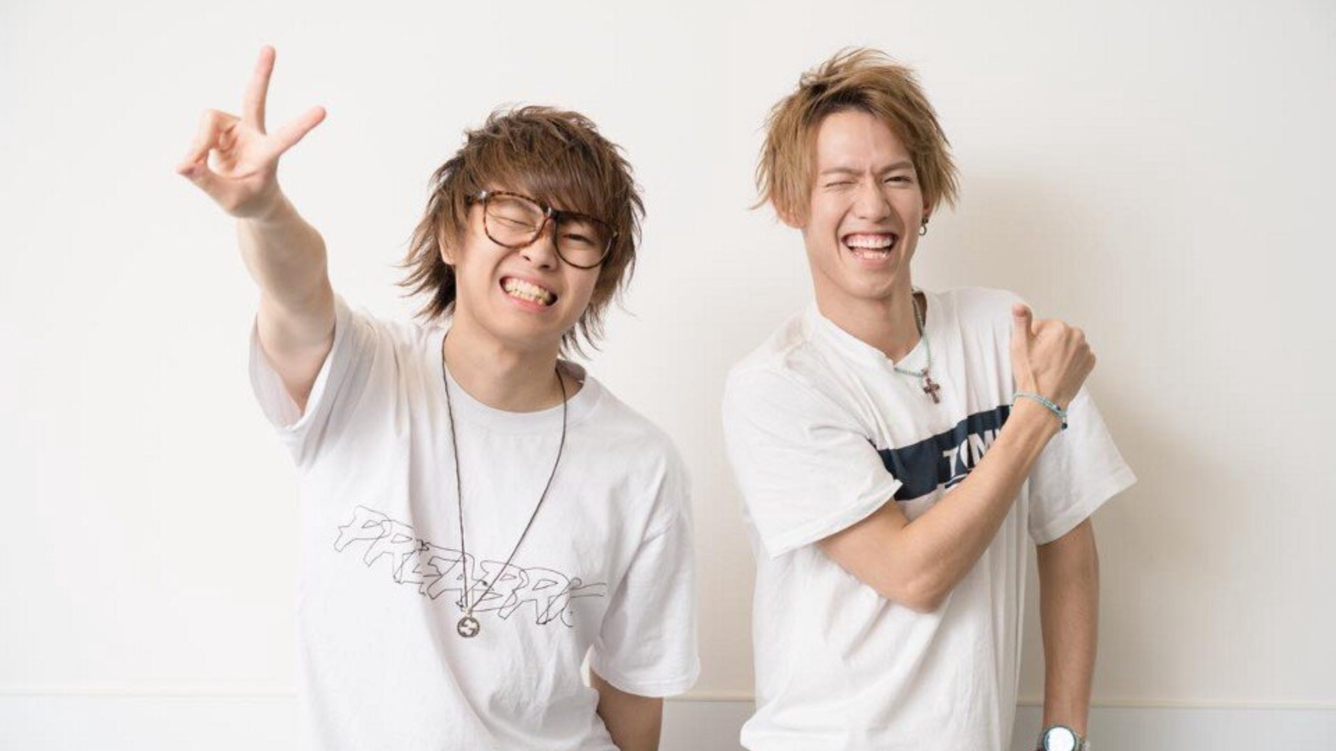 Two individuals posing in casual attire.